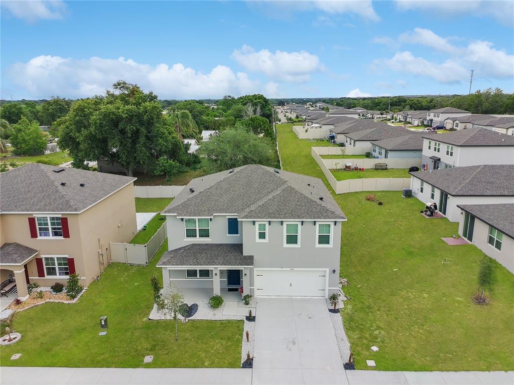 2085 Doe Run Drive Davenport, FL 33837 - Photo 2 of 44 a aerial view of a house with a garden