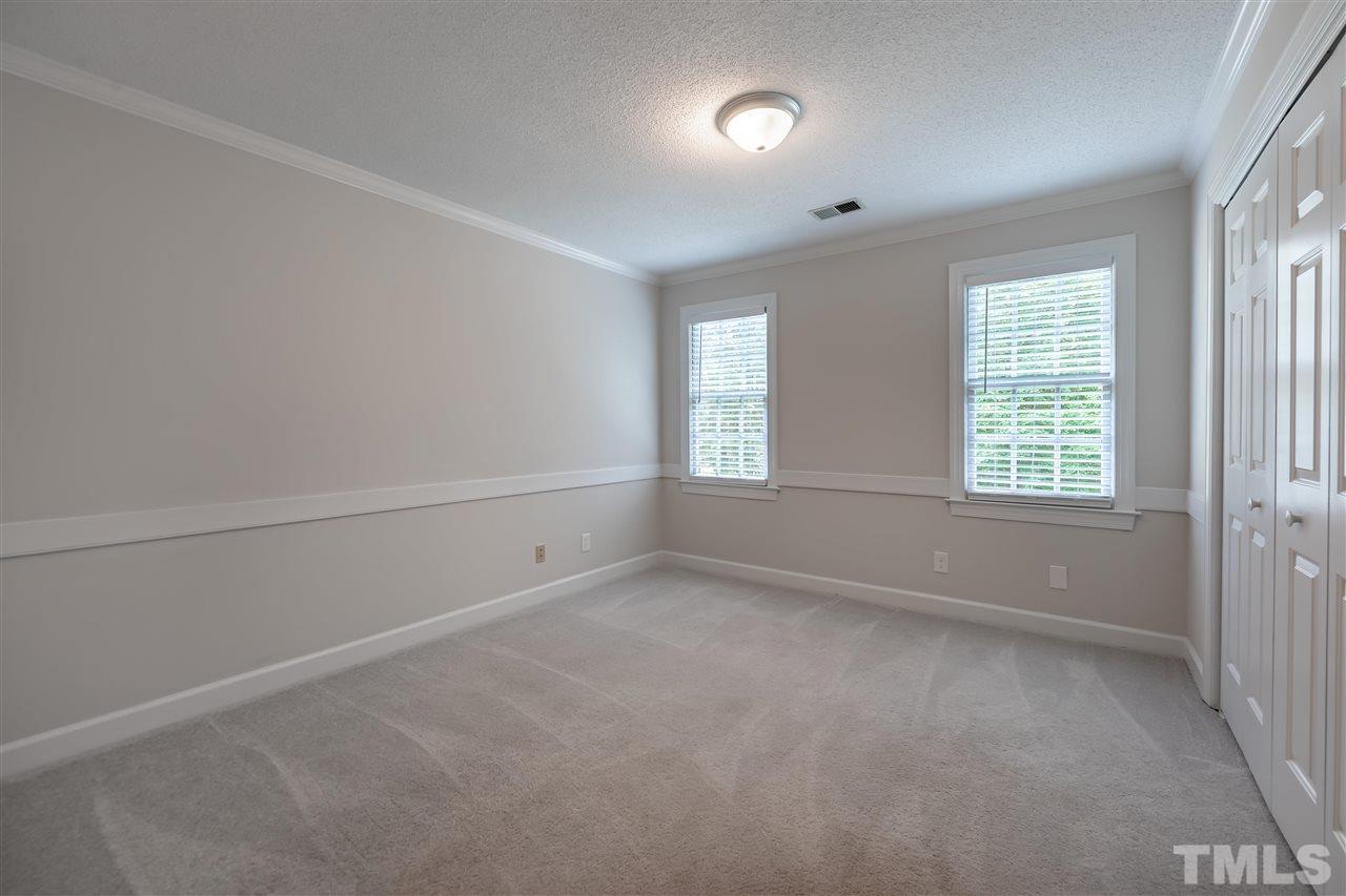 2408 Heartley Drive Raleigh, NC 27615 - Photo 12 of 26 an empty room with windows