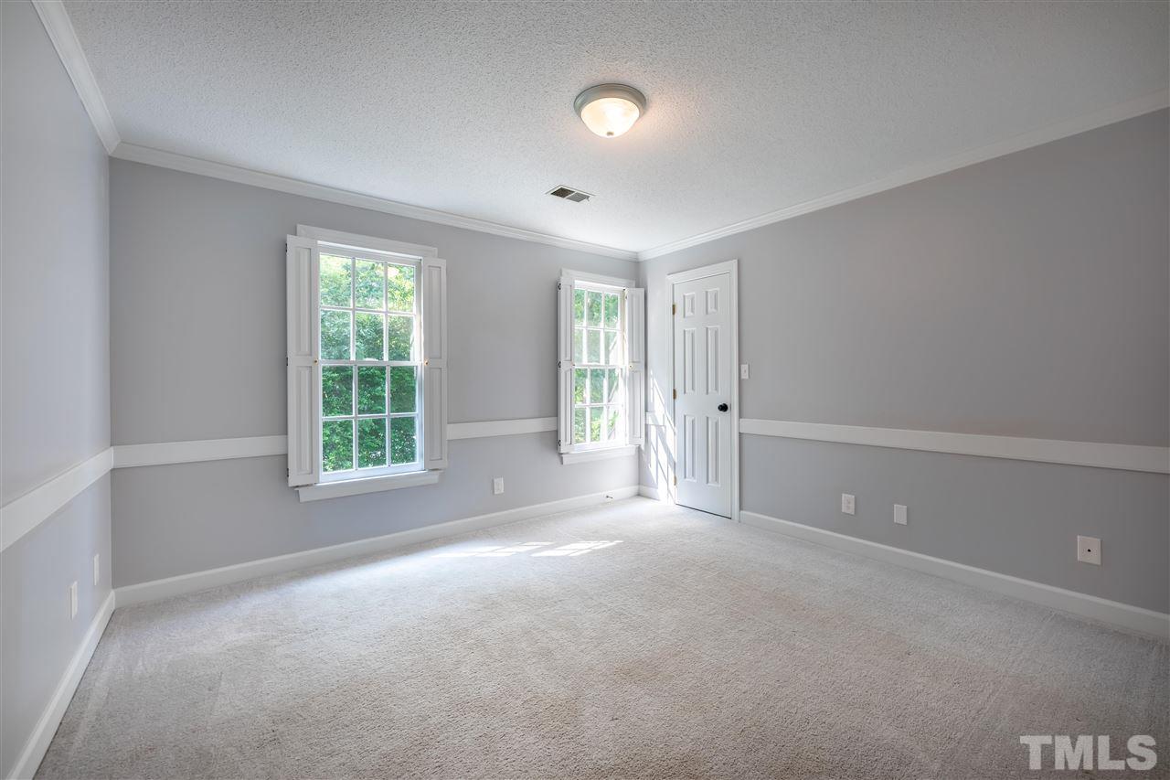 2408 Heartley Drive Raleigh, NC 27615 - Photo 13 of 26 an empty room with windows and closet