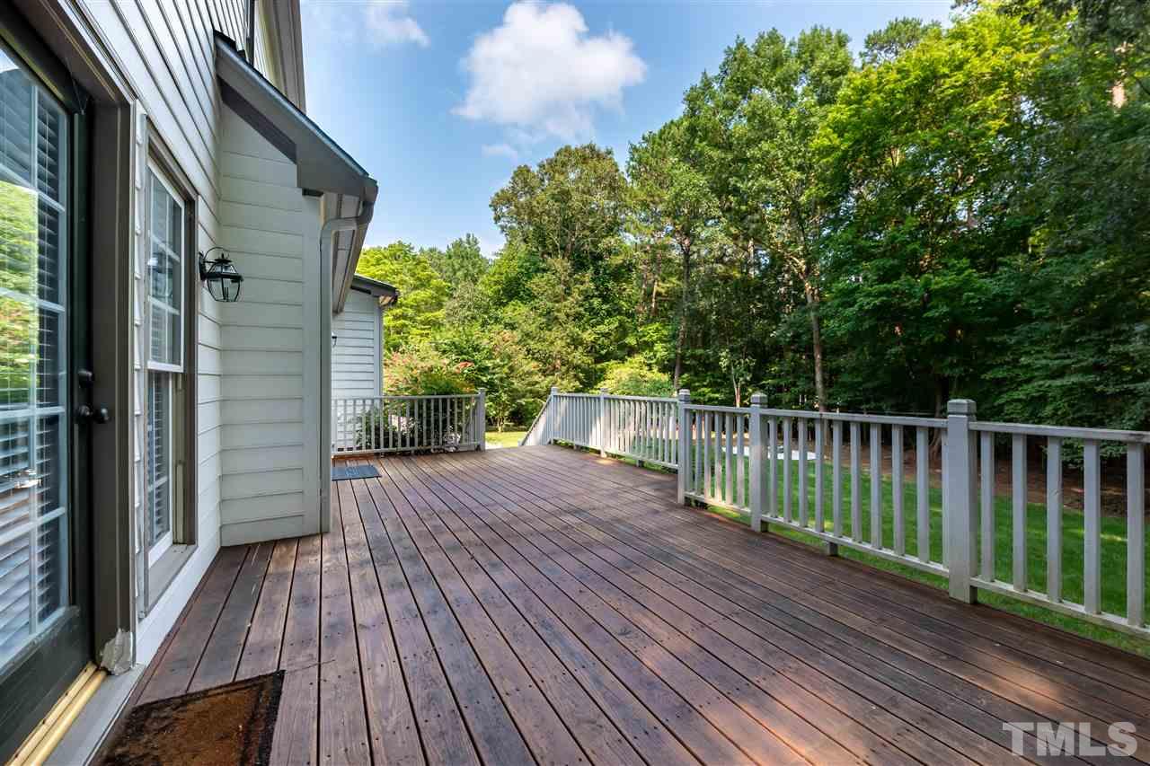 2408 Heartley Drive Raleigh, NC 27615 - Photo 3 of 26 a view of deck with wooden floor and fence