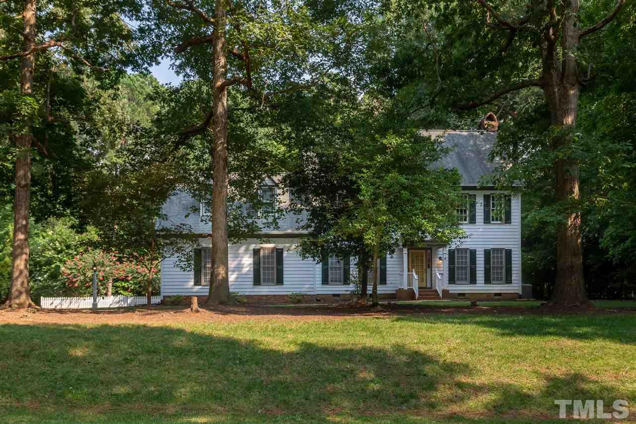 2408 Heartley Drive Raleigh, NC 27615 - Photo 24 of 26 a front view of a house with a garden