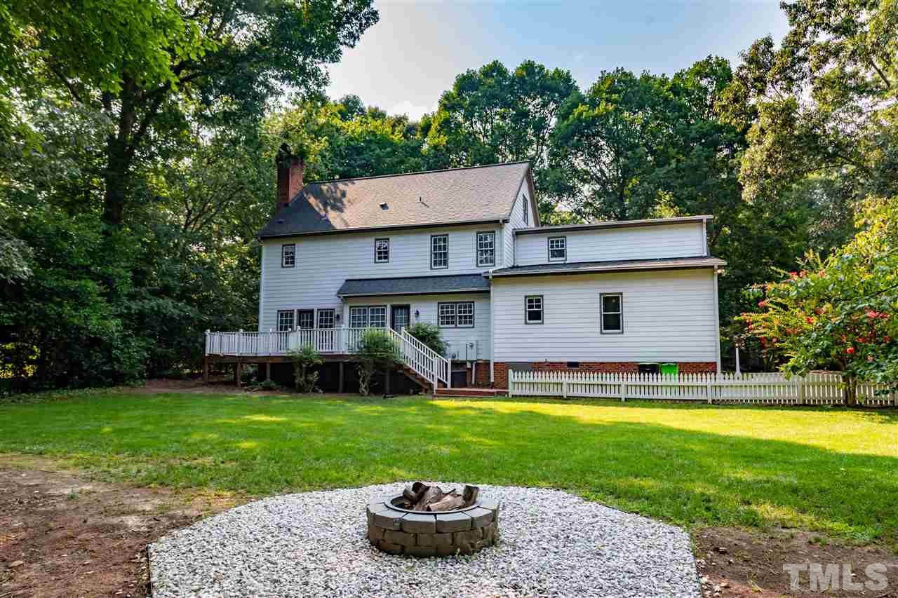 2408 Heartley Drive Raleigh, NC 27615 - Photo 25 of 26 a view of a house with a yard and a tree