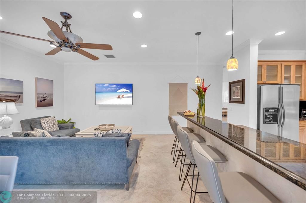 3315 Northeast 17th Street Fort Lauderdale, FL 33305 - Photo 12 of 41 a living room with furniture and a flat screen tv