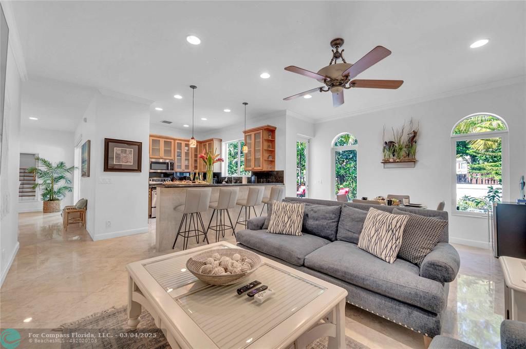 3315 Northeast 17th Street Fort Lauderdale, FL 33305 - Photo 2 of 41 a living room with furniture kitchen and a table