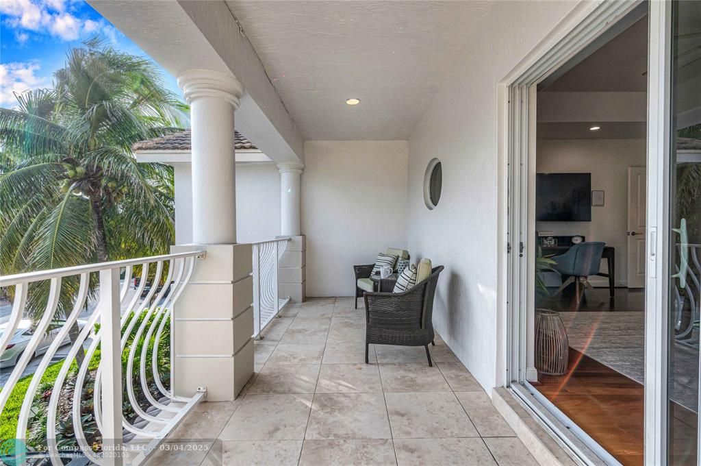 3315 Northeast 17th Street Fort Lauderdale, FL 33305 - Photo 21 of 41 a balcony with furniture and a potted plant