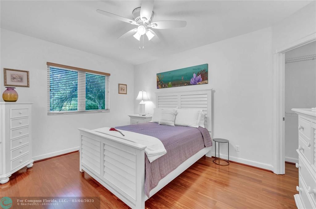3315 Northeast 17th Street Fort Lauderdale, FL 33305 - Photo 27 of 41 a bedroom with a bed and a window