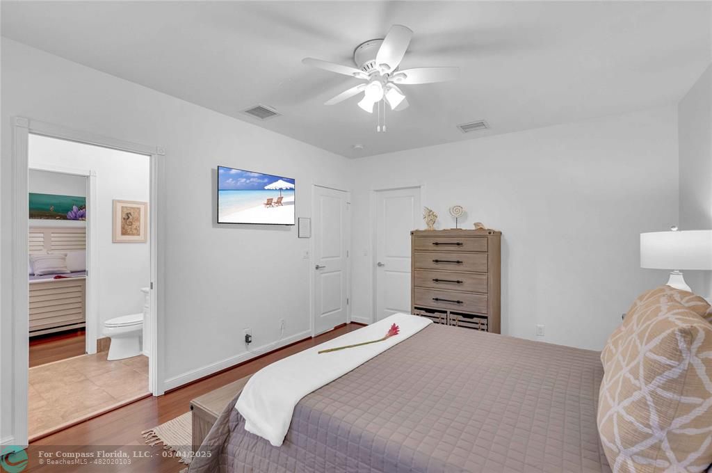 3315 Northeast 17th Street Fort Lauderdale, FL 33305 - Photo 30 of 41 a bedroom with a bed and a view of bedroom