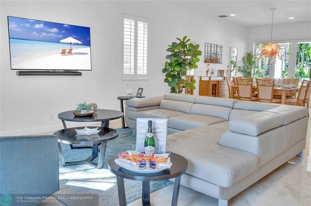 3315 Northeast 17th Street Fort Lauderdale, FL 33305 - Photo 3 of 41 a living room with furniture and a large window