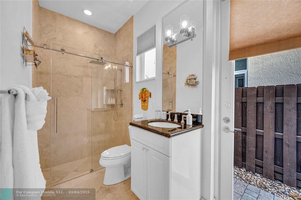 3315 Northeast 17th Street Fort Lauderdale, FL 33305 - Photo 35 of 41 a bathroom with a sink toilet a mirror and shower