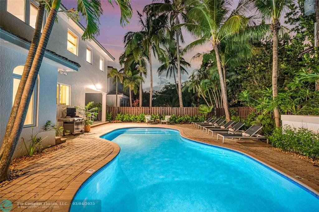 3315 Northeast 17th Street Fort Lauderdale, FL 33305 - Photo 37 of 41 a view of a house with swimming pool and sitting area
