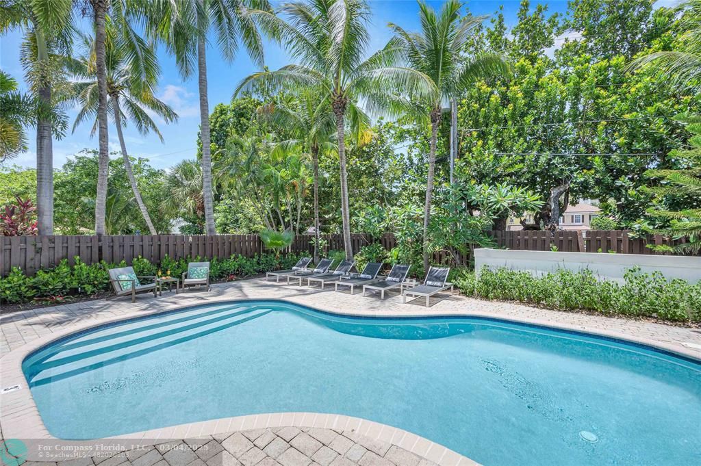 3315 Northeast 17th Street Fort Lauderdale, FL 33305 - Photo 6 of 41 a view of a house with a yard and sitting area