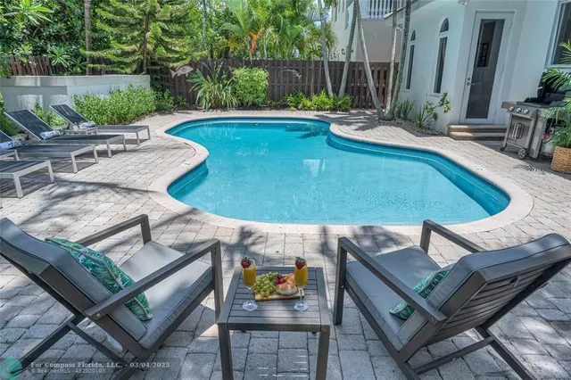 a view of outdoor space yard swimming pool and furniture