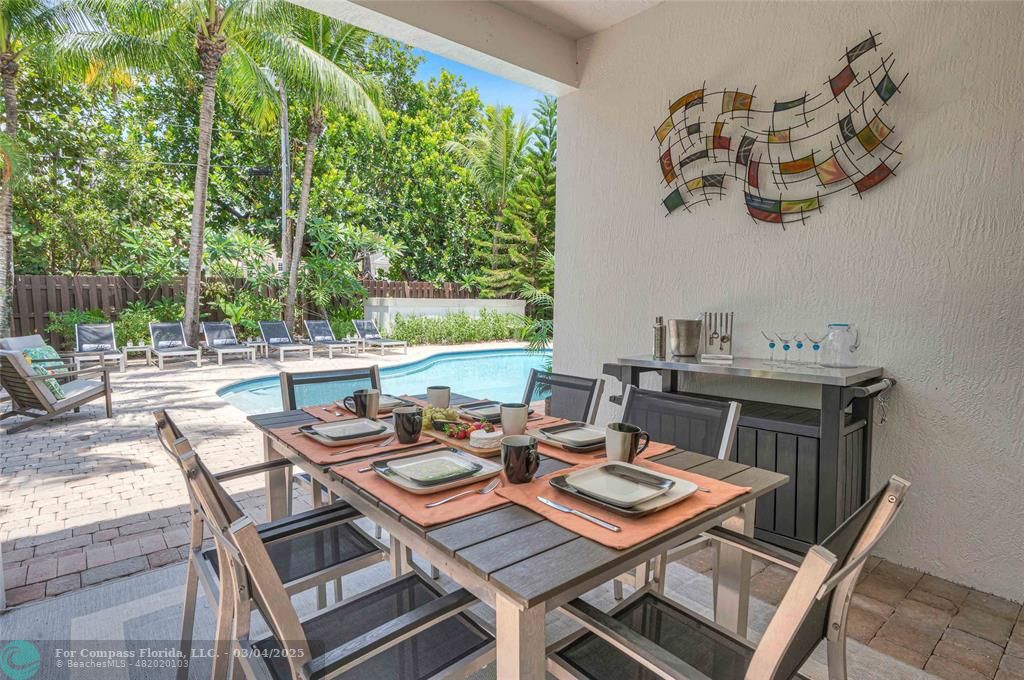 3315 Northeast 17th Street Fort Lauderdale, FL 33305 - Photo 9 of 41 a view of a patio with furniture