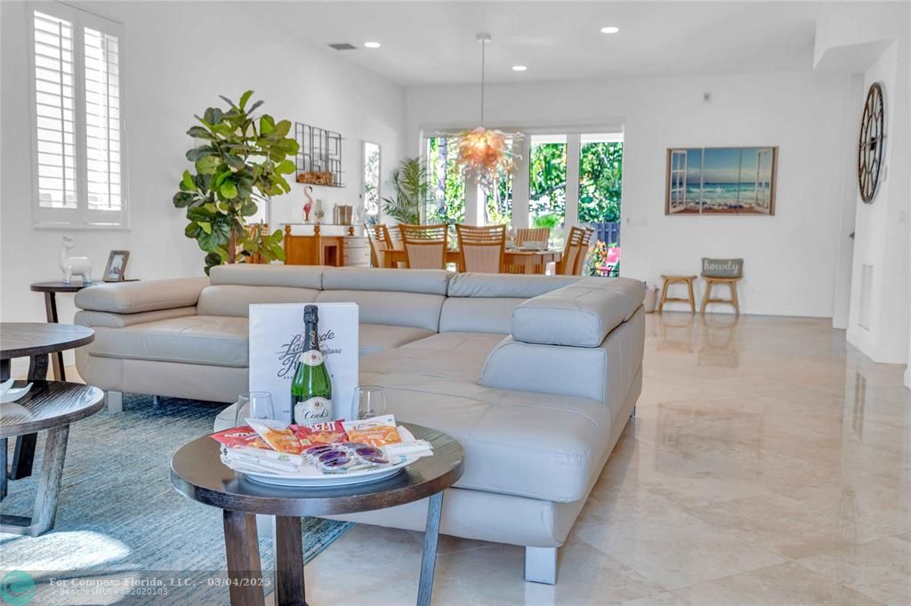 3315 Northeast 17th Street Fort Lauderdale, FL 33305 - Photo 10 of 41 a living room with furniture and a large window