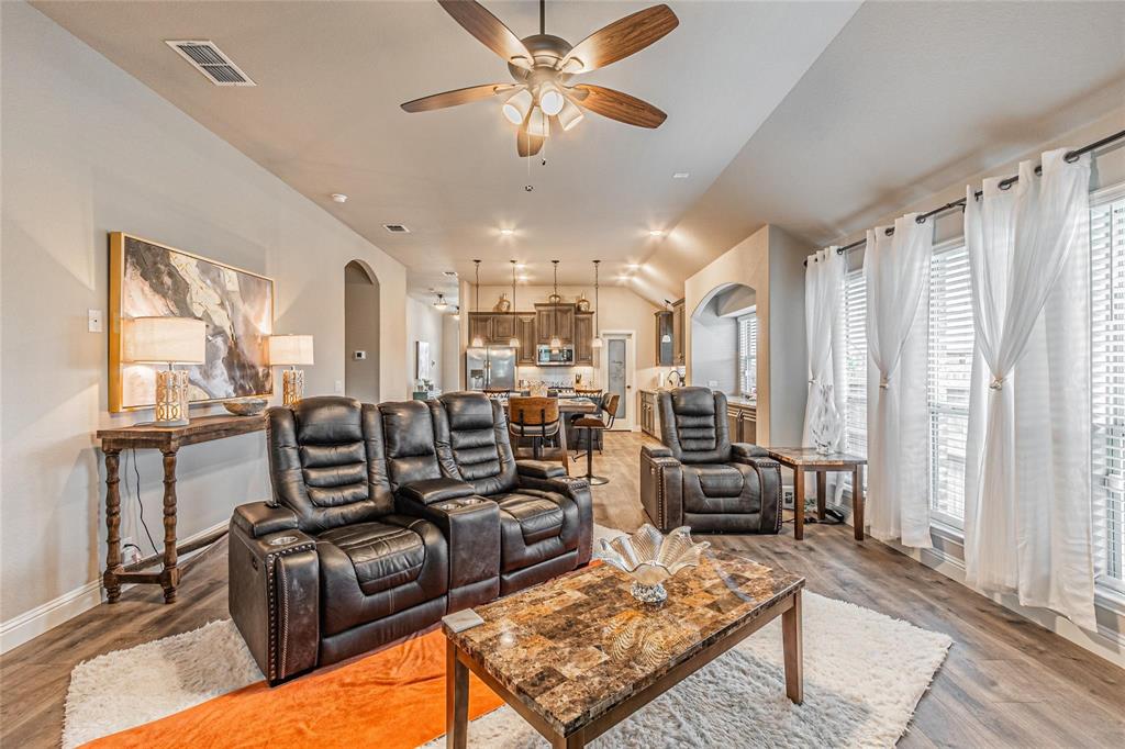 4201 Misty Ridge Street Mesquite, TX 75181 - Photo 20 of 39 Living room featuring hardwood / wood-style flooring, ceiling fan, and plenty of natural light