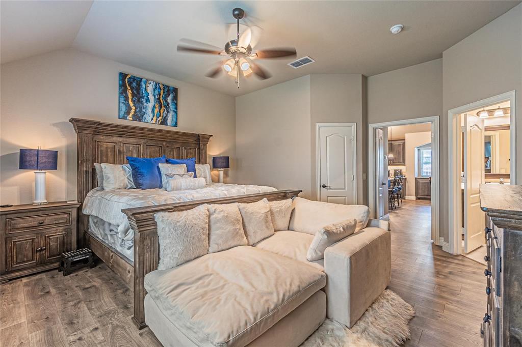 4201 Misty Ridge Street Mesquite, TX 75181 - Photo 23 of 39 Bedroom with ceiling fan, lofted ceiling, and hardwood / wood-style flooring