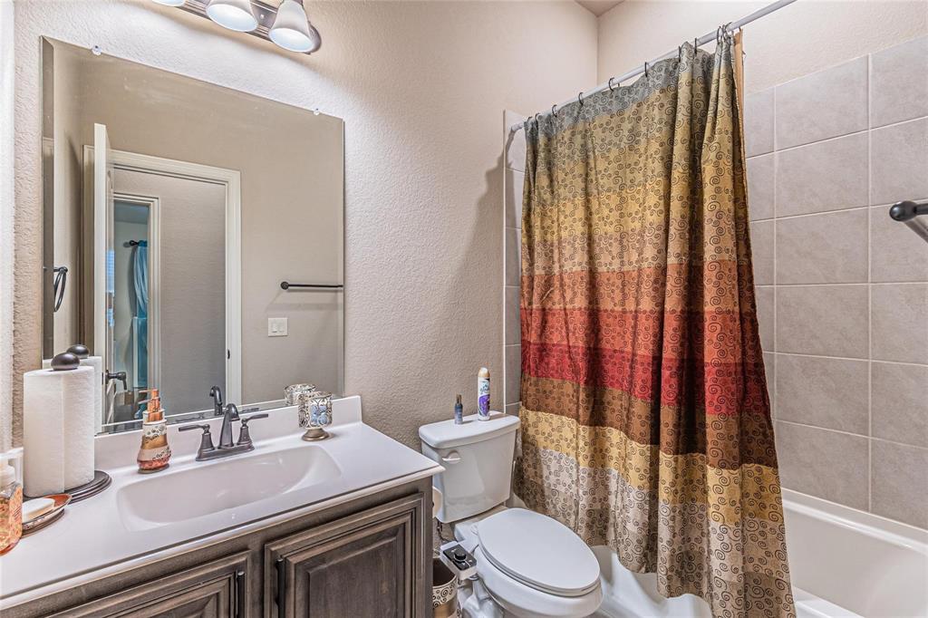 4201 Misty Ridge Street Mesquite, TX 75181 - Photo 26 of 39 Full bathroom featuring shower / bath combo, toilet, and vanity