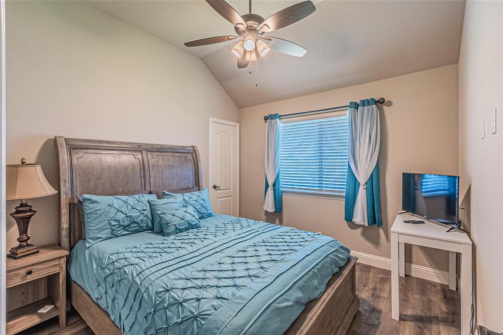 4201 Misty Ridge Street Mesquite, TX 75181 - Photo 27 of 39 Bedroom with ceiling fan, hardwood / wood-style floors, and lofted ceiling
