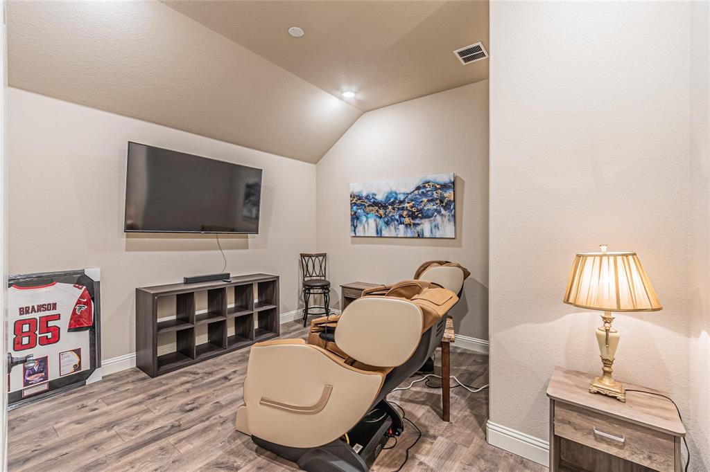 4201 Misty Ridge Street Mesquite, TX 75181 - Photo 28 of 39 Sitting room featuring wood-type flooring and vaulted ceiling