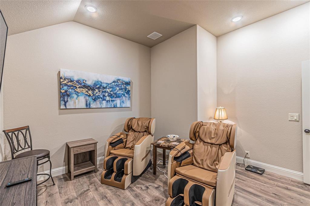 4201 Misty Ridge Street Mesquite, TX 75181 - Photo 29 of 39 Living area featuring wood-type flooring and lofted ceiling