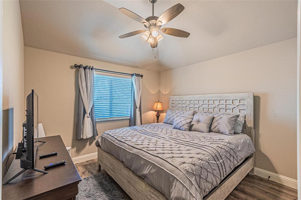 4201 Misty Ridge Street Mesquite, TX 75181 - Photo 30 of 39 Bedroom featuring dark hardwood / wood-style flooring, vaulted ceiling, and ceiling fan