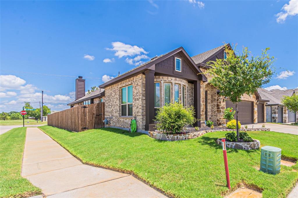 4201 Misty Ridge Street Mesquite, TX 75181 - Photo 3 of 39 View of front facade with a garage and a front lawn
