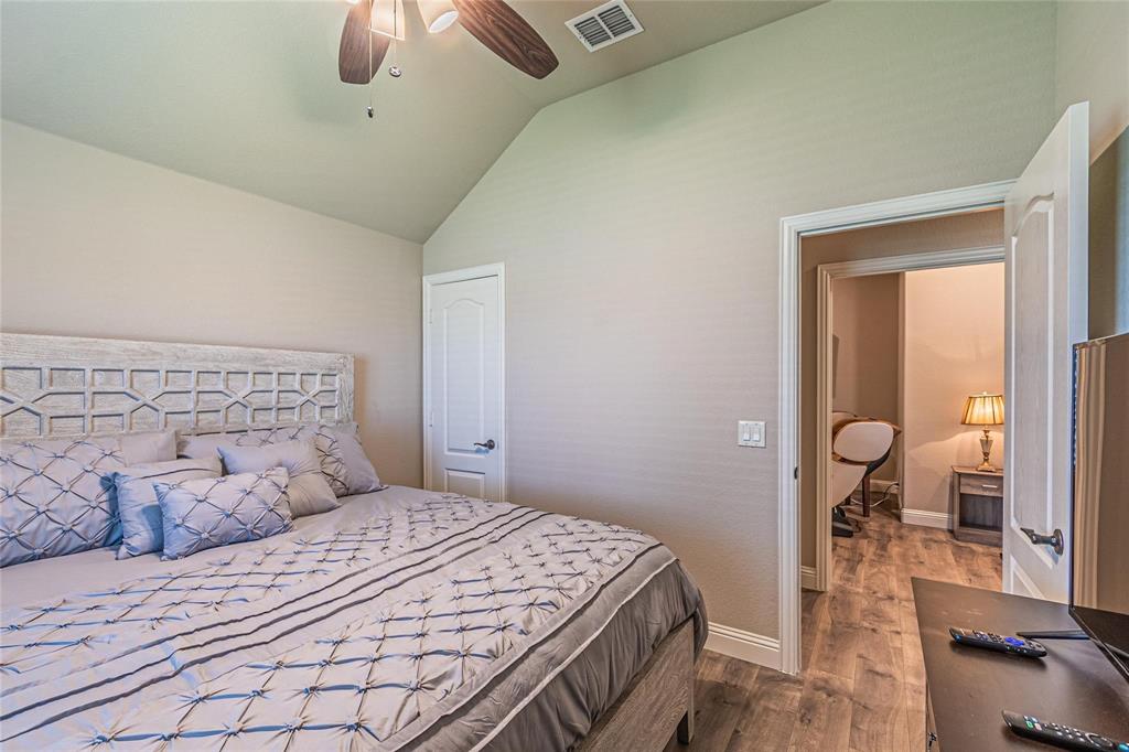 4201 Misty Ridge Street Mesquite, TX 75181 - Photo 31 of 39 Bedroom with ceiling fan, wood-type flooring, and lofted ceiling
