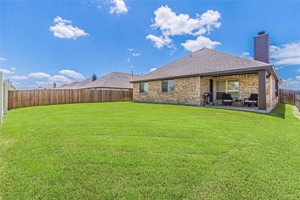 4201 Misty Ridge Street Mesquite, TX 75181 - Photo 35 of 39 View of yard featuring an outdoor living space and a patio