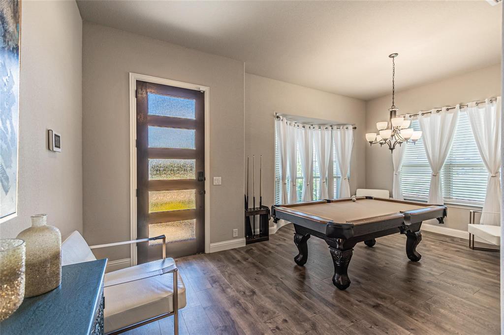 4201 Misty Ridge Street Mesquite, TX 75181 - Photo 6 of 39 Recreation room featuring a chandelier, dark wood-type flooring, and billiards