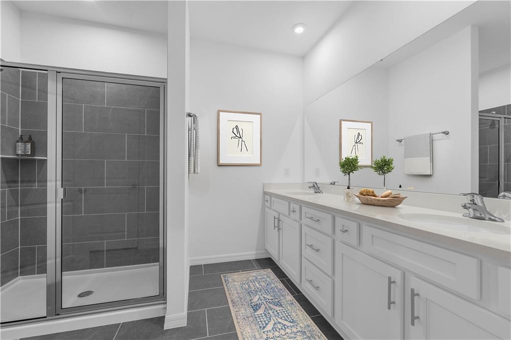 328 Cavalier Lane Acworth, GA 30102 - Photo 15 of 42 a bathroom with a double vanity sink mirror and shower