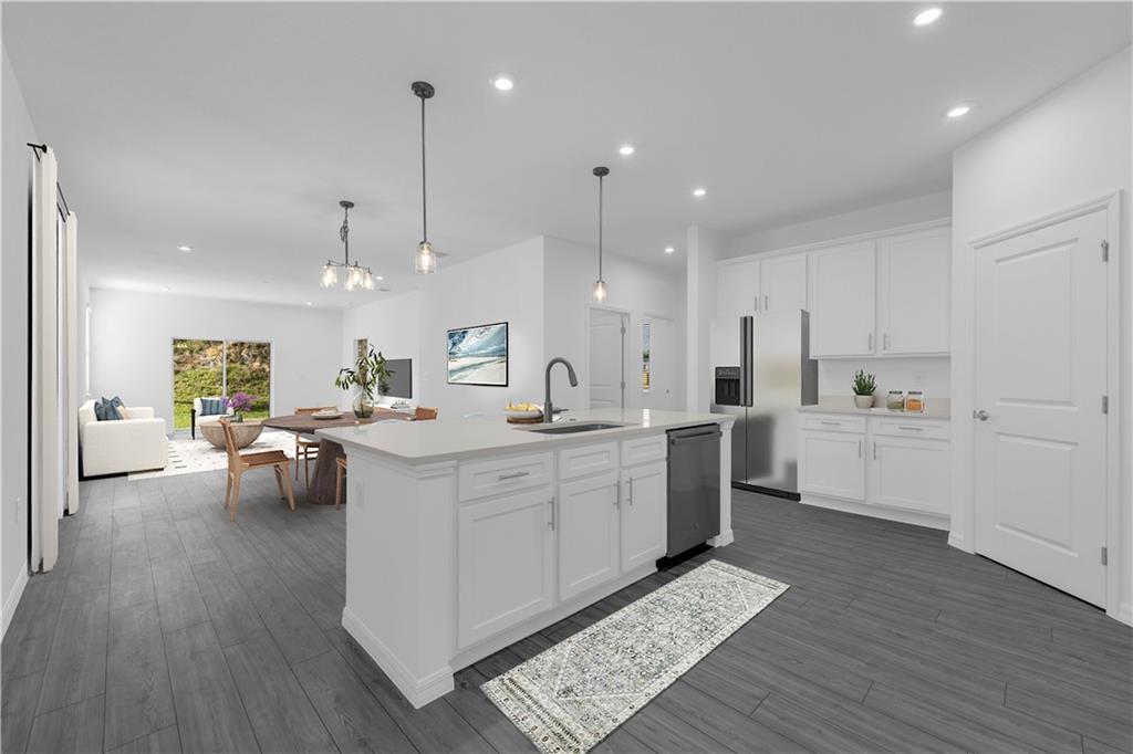 328 Cavalier Lane Acworth, GA 30102 - Photo 2 of 42 a large white kitchen with lots of counter space a sink appliances and cabinets