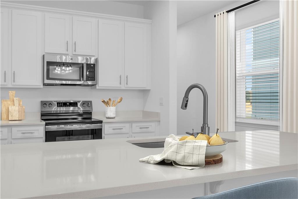 328 Cavalier Lane Acworth, GA 30102 - Photo 6 of 42 a kitchen with a sink cabinets and appliances