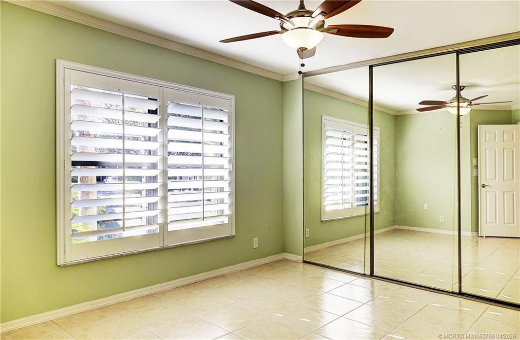 5290 Southeast Seascape Way, Unit 201 Stuart, FL 34997 - Photo 11 of 30 a view of an empty room with a window