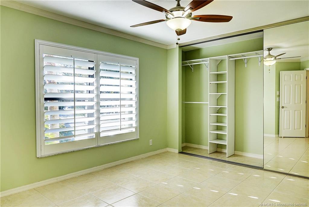 5290 Southeast Seascape Way, Unit 201 Stuart, FL 34997 - Photo 12 of 30 a view of an empty room with a window