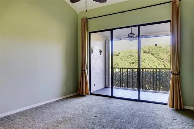 a view of empty room with floor to ceiling window