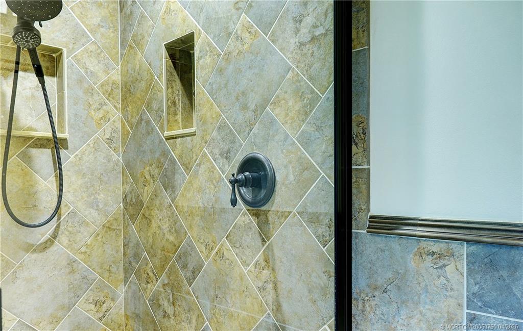 5290 Southeast Seascape Way, Unit 201 Stuart, FL 34997 - Photo 20 of 30 a bathroom with a shower