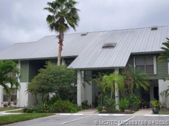 5290 Southeast Seascape Way, Unit 201 Stuart, FL 34997 - Photo 23 of 30 a front view of a house with garden