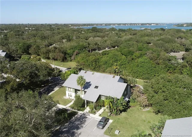an aerial view of a house with a garden