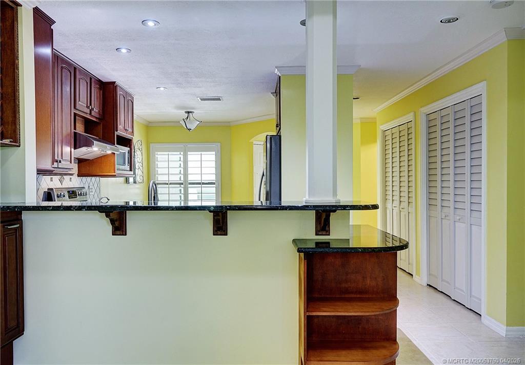 5290 Southeast Seascape Way, Unit 201 Stuart, FL 34997 - Photo 6 of 30 a view of a kitchen with a window