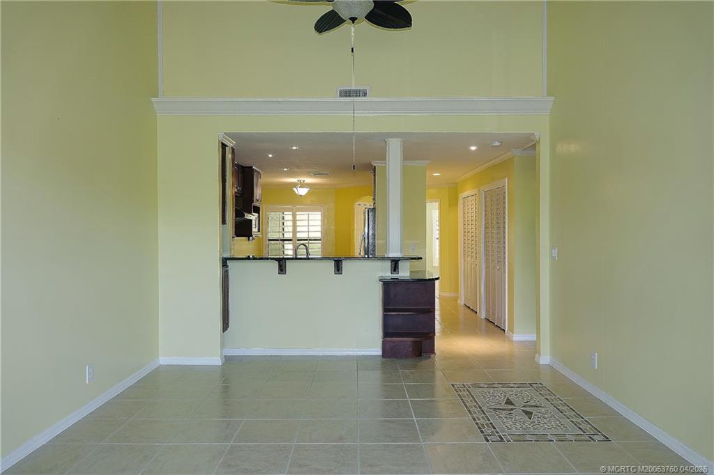 5290 Southeast Seascape Way, Unit 201 Stuart, FL 34997 - Photo 7 of 30 a view of kitchen with a sink and a mirror