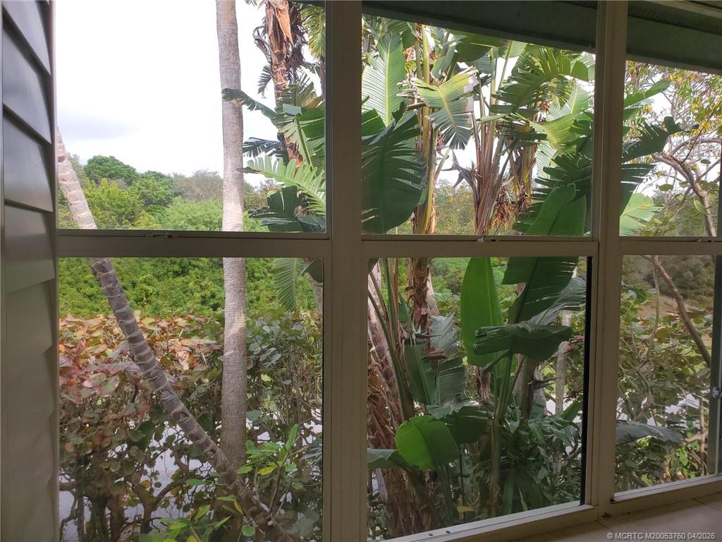 5290 Southeast Seascape Way, Unit 201 Stuart, FL 34997 - Photo 9 of 30 a view of backyard from a window