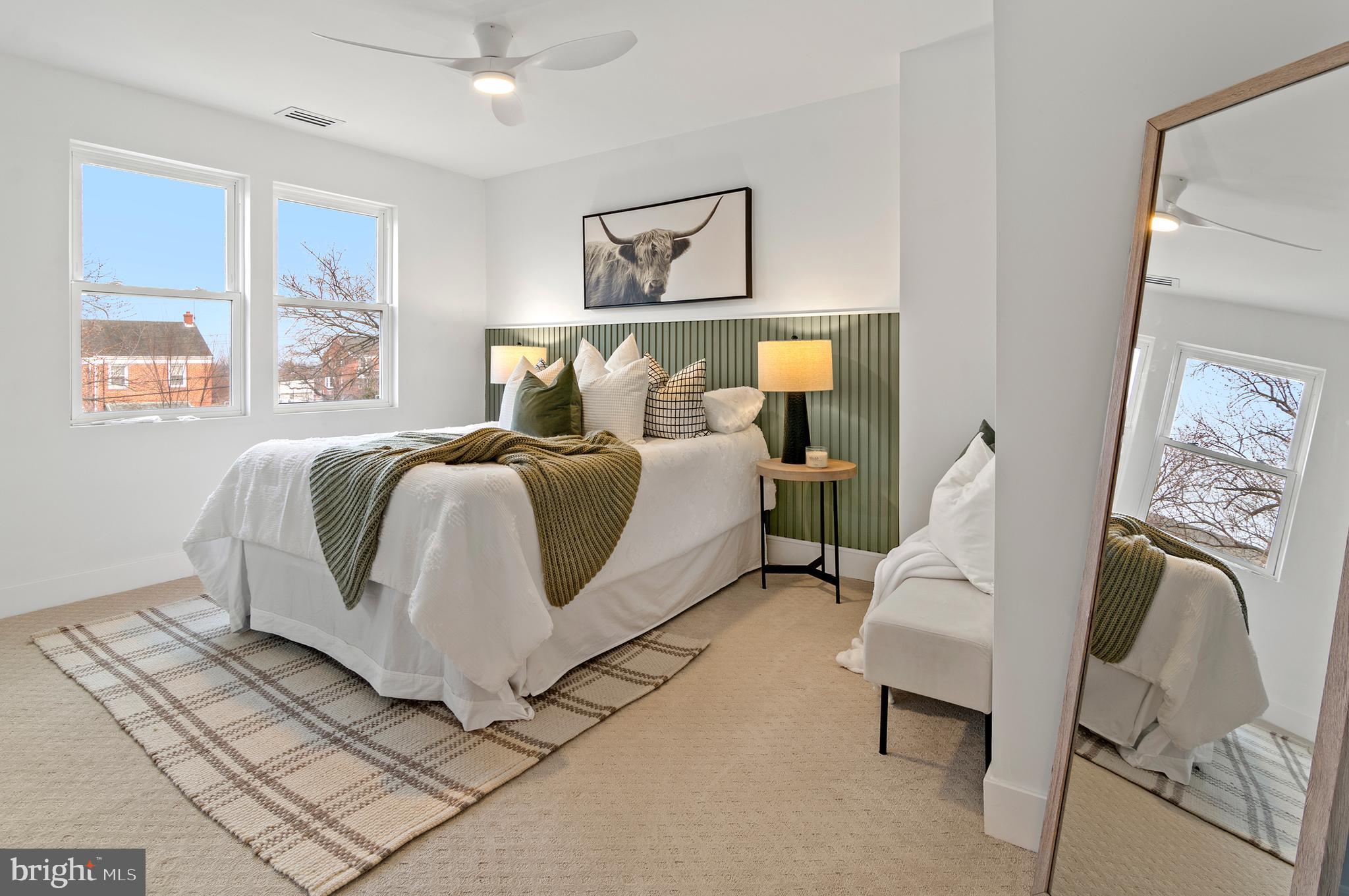 5905 Glenkirk Road Baltimore, MD 21239 - Photo 14 of 31 a bed room with a bed and a couch