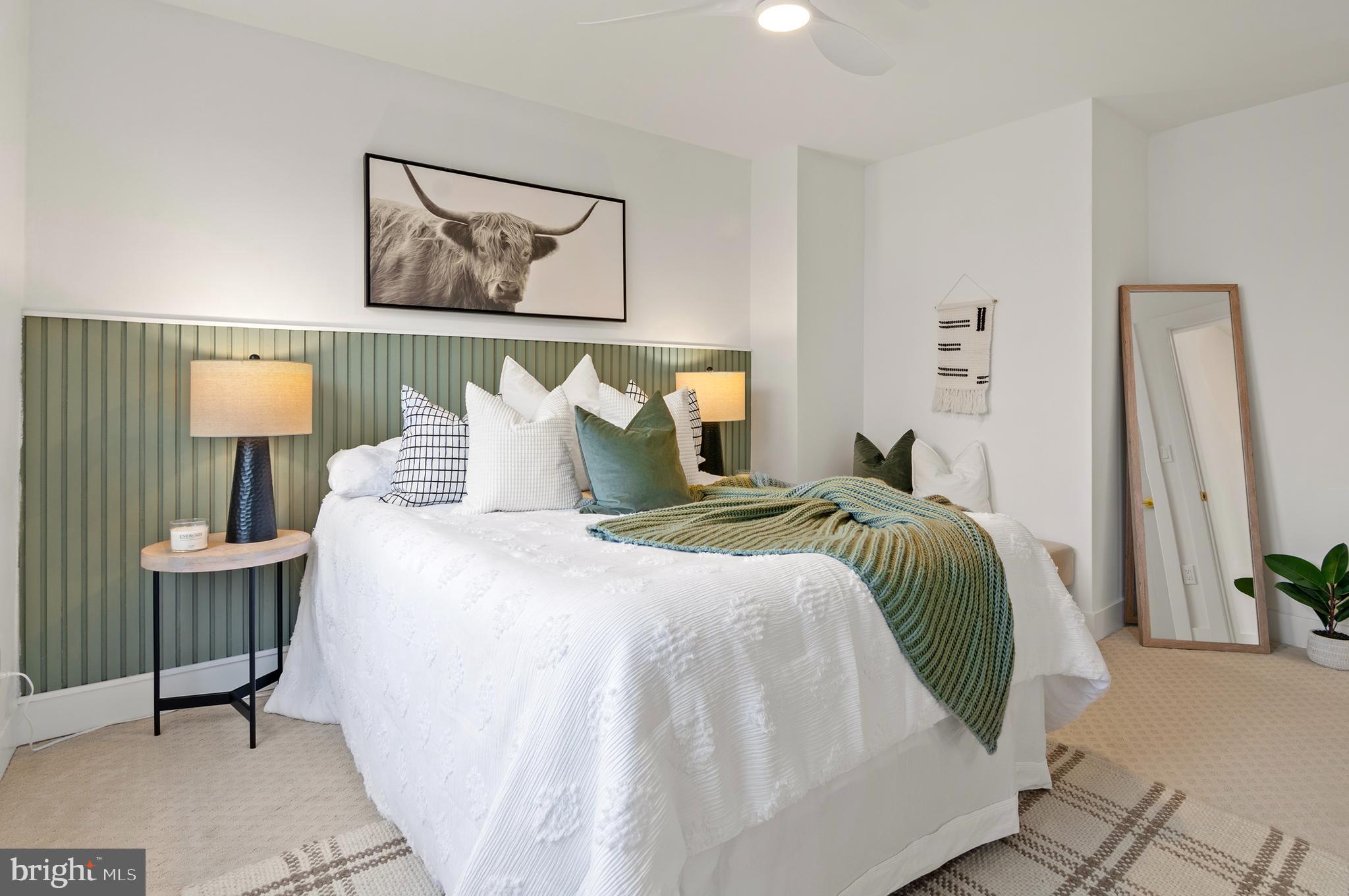 5905 Glenkirk Road Baltimore, MD 21239 - Photo 15 of 31 a bedroom with a bed and a painting on the wall