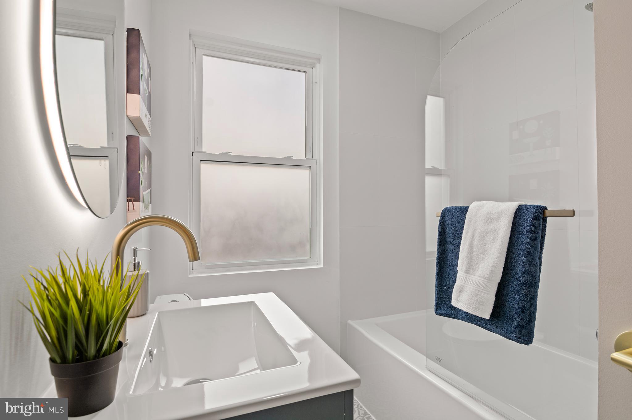 5905 Glenkirk Road Baltimore, MD 21239 - Photo 22 of 31 a close view of sink with a bathtub