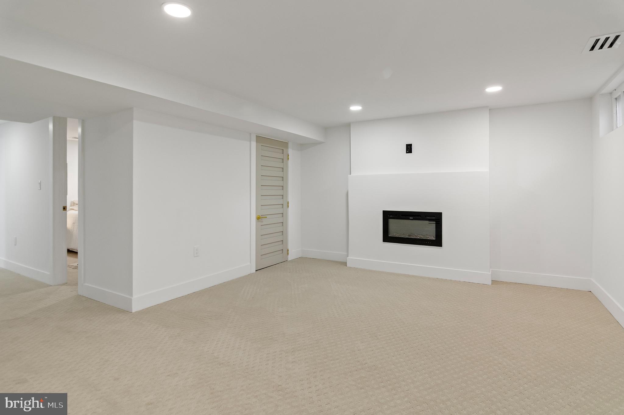 5905 Glenkirk Road Baltimore, MD 21239 - Photo 24 of 31 a view of an empty room with a window