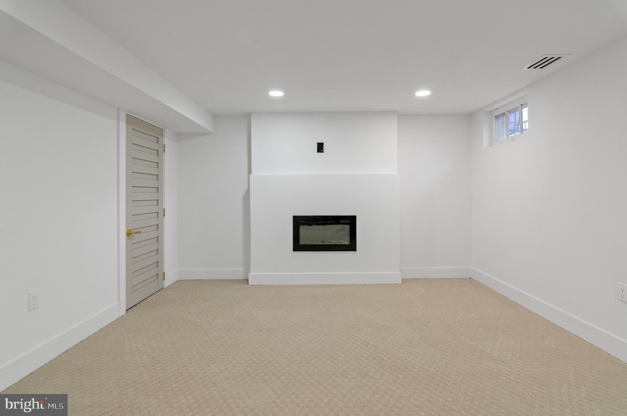 5905 Glenkirk Road Baltimore, MD 21239 - Photo 25 of 31 a view of an empty room with a window