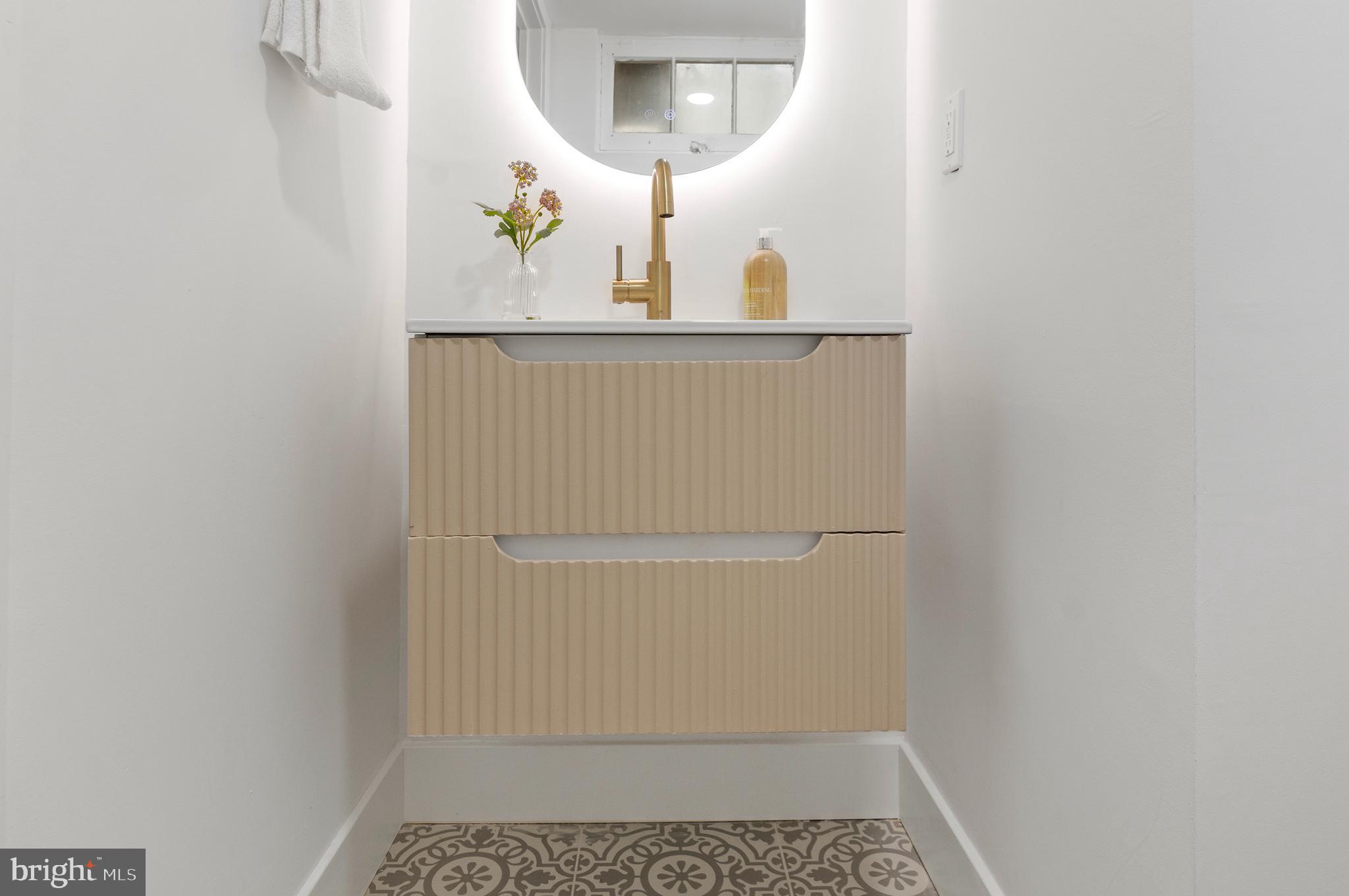 5905 Glenkirk Road Baltimore, MD 21239 - Photo 27 of 31 a bathroom with a sink