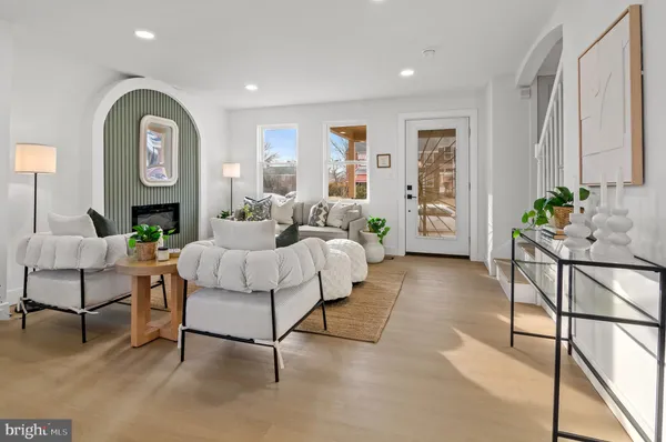 a living room with furniture and a clock