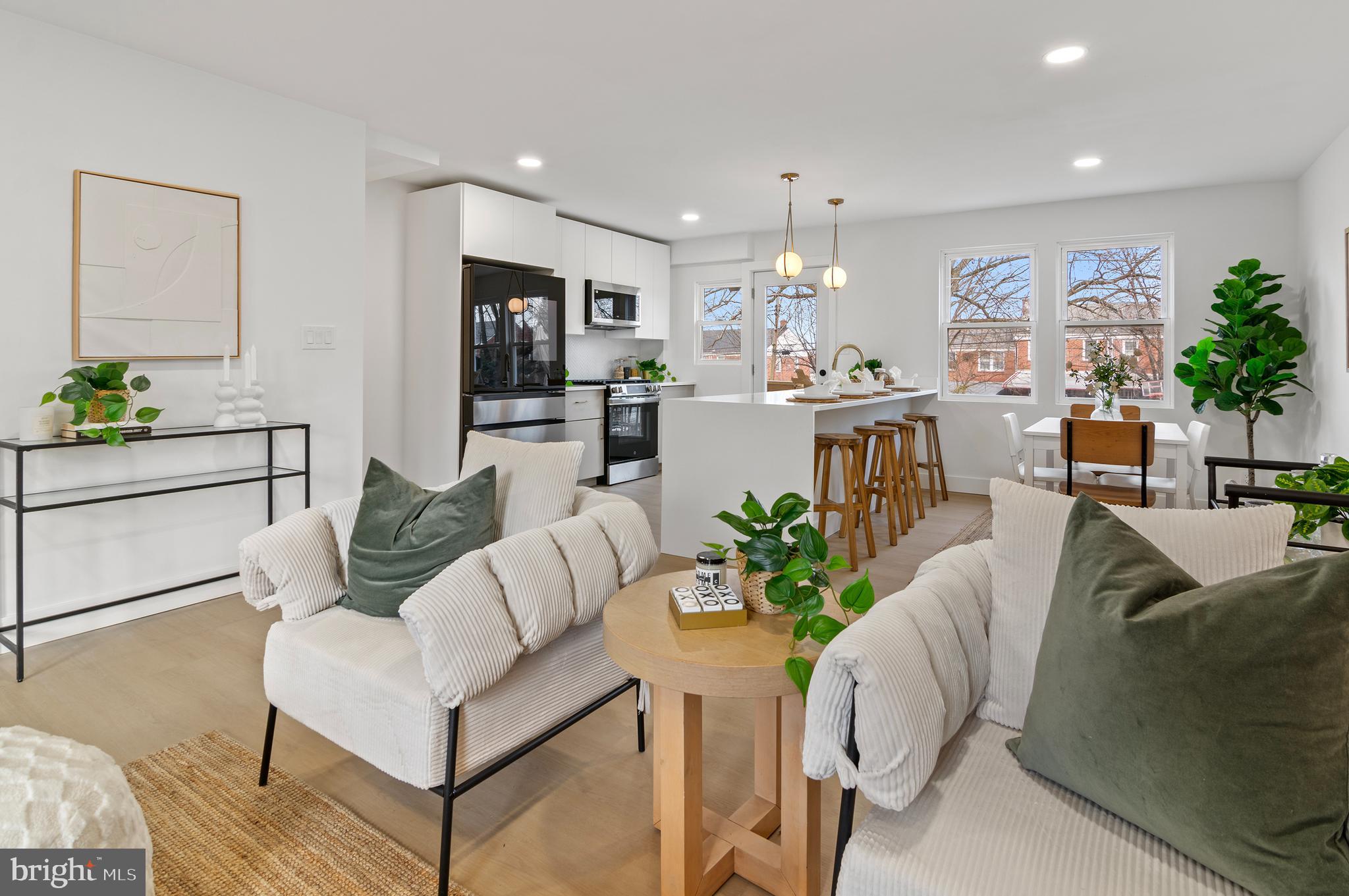 5905 Glenkirk Road Baltimore, MD 21239 - Photo 6 of 31 a living room with furniture and a flat screen tv