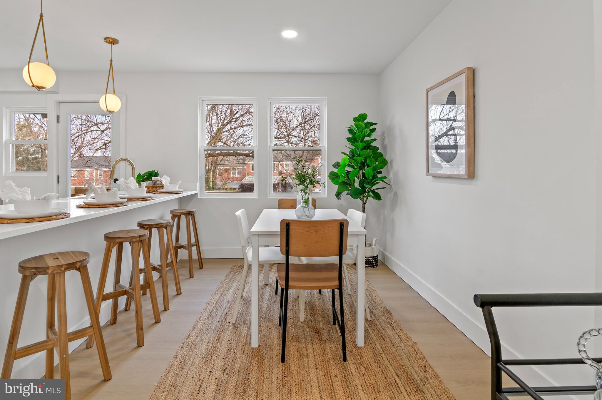 5905 Glenkirk Road Baltimore, MD 21239 - Photo 8 of 31 a dining room with furniture and window
